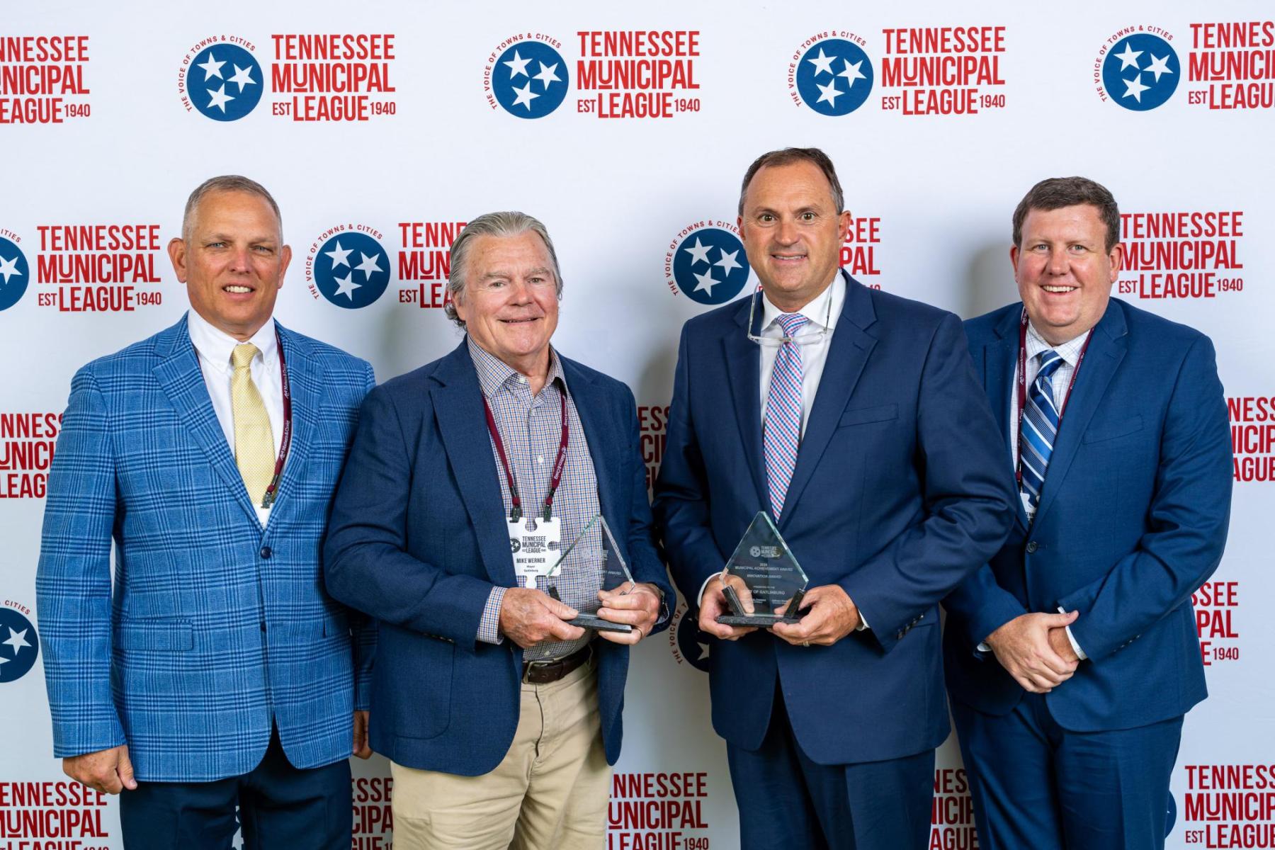 From left to right, Gatlinburg  Public Works Director Roger Sims, Mayor Mike Werner, City Manager Greg Patterson, and Public Information Officer Seth Butler accept the awards for Excellence in Public Works and the Innovation Award. 